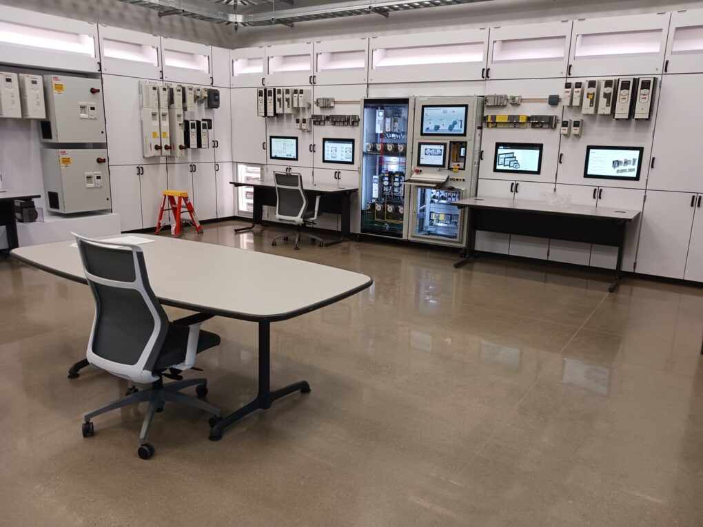 The new ABB drives and services manufacturing and logistics center, New Berlin, Wisconsin, includes a fieldbus connectivity area, said Jeff Fell, application engineering manager, including areas for building automation controller communication, industrial programmable logic controller (PLC) network protocols and industrial PLC network safety protocols. Courtesy: Mark T. Hoske, Control Engineering, WTWH Media