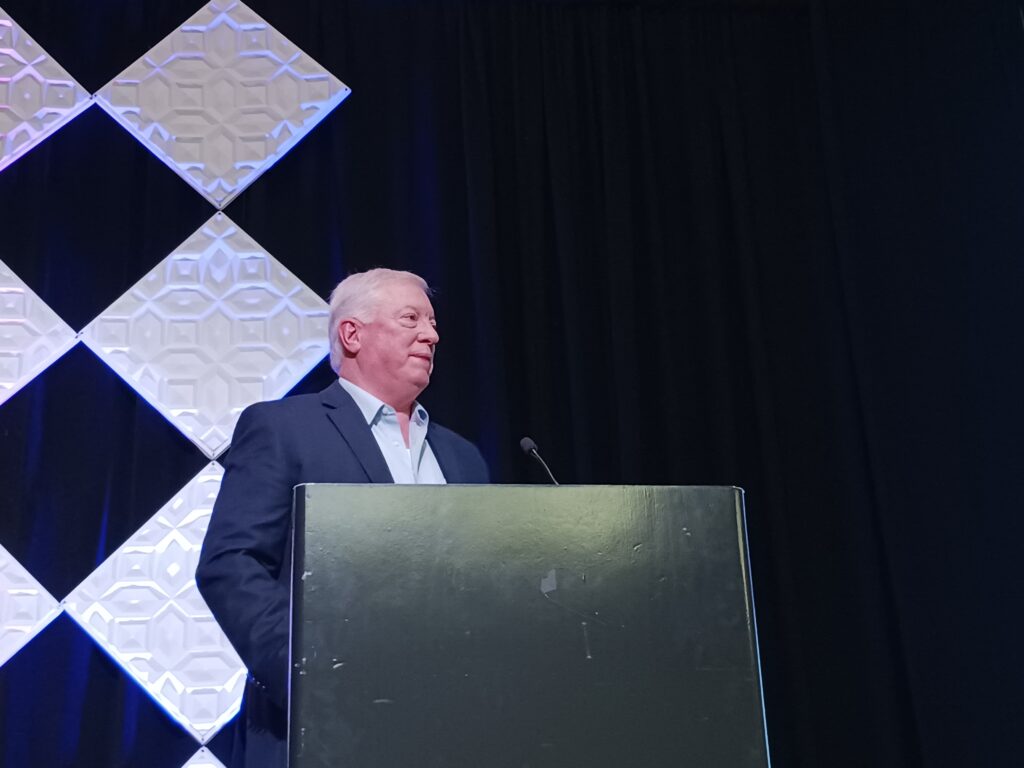 Figure 1: Audience applause followed the announcement that ExxonMobil Resins Finishing Plant in Baton Rouge, Louisiana, is operating using the Open Process Automation Standard (O-PAS), as described at the 2025 ARC Industry Leadership Forum by ARC Advisory Group. The open architecture, standards-based system and its hardware and software components are “replaceable, interchangeable and interoperable,” said David DeBari, R&D team leader, ExxonMobil. Courtesy: Mark T. Hoske, Control Engineering