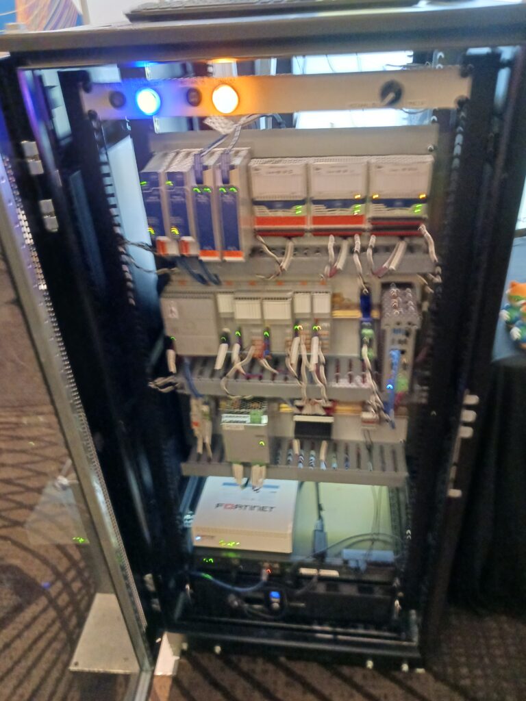 Figure 15: The Yokogawa booth shows Open Process Automation, with a COPA500 Controller from Collaborative Systems Integration (CSI), Phoenix Contact for power and I/O, an ASRock Industrial controller, Supermicro HMI and a Cisco gateway, at the 2025 ARC Industry Leadership Forum by ARC Advisory Group. Courtesy: Mark T. Hoske, Control Engineering